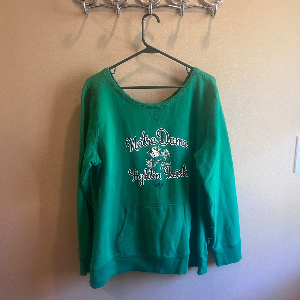 Green Notre Dame Fighting Irish sweatshirt.  Adidas. ND script plus leprechaun.